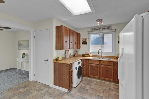 Photo of 27 Bedridge Way NE, Calgary, AB T3K 1M2 (MLS # A2335133)