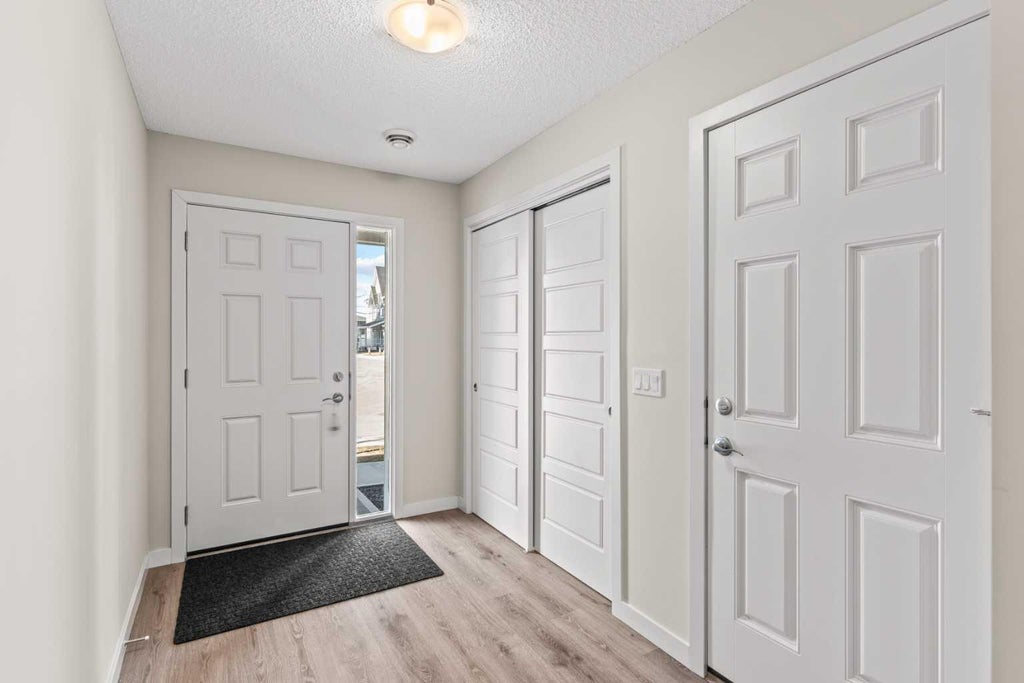 Photo of 32 Red Embers Parade NE #310, Calgary, AB T3N 1P7 (MLS # A2348104)