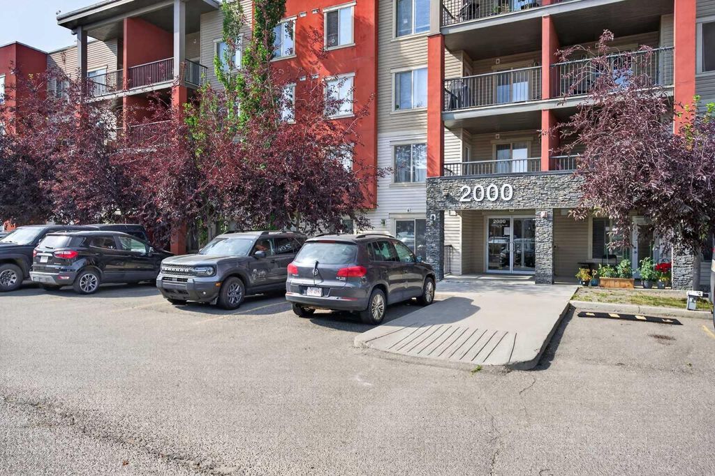 Photo of 403 Mackenzie Way SW #2403, Airdrie, AB T4B 3V7 (MLS # A2331163)