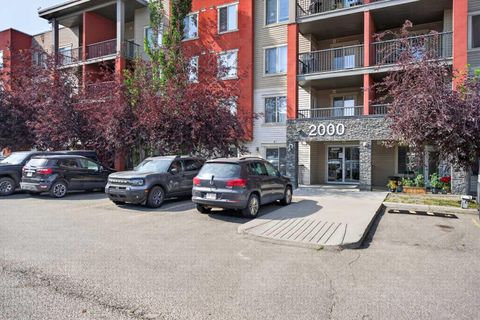 Photo of 403 Mackenzie Way SW #2403, Airdrie, AB T4B 3V7 (MLS # A2331163)