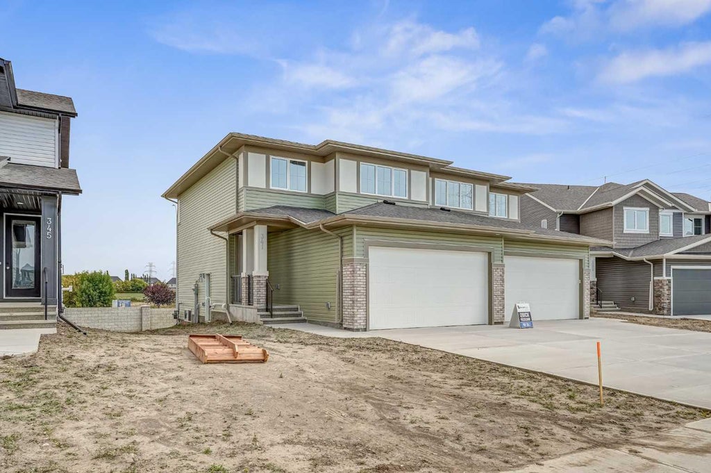 Photo of 341 Dawson Wharf Road, Chestermere, AB T1X 2W4 (MLS # A2342940)