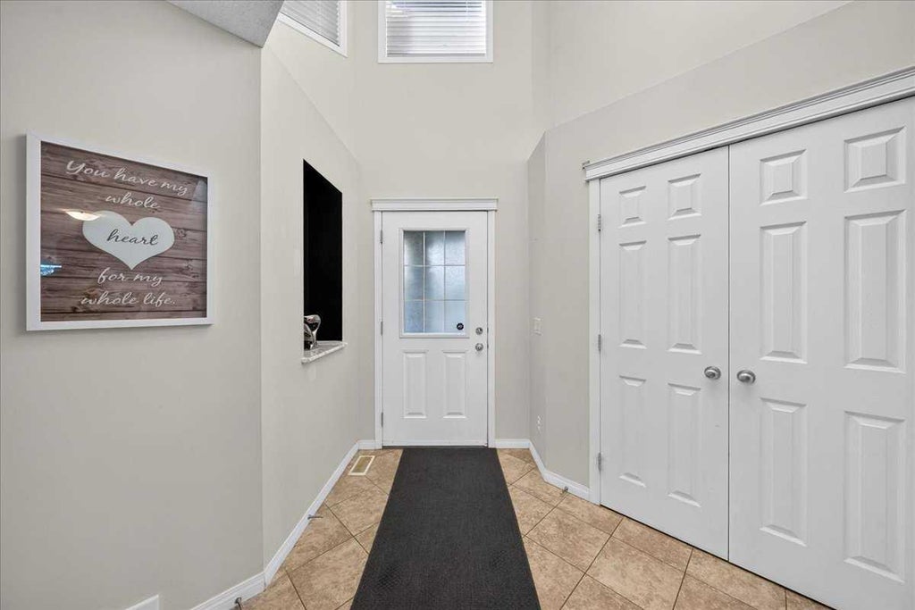 Photo of 117 Panora Way NW, Calgary, AB T3K 0R4 (MLS # A2351873)