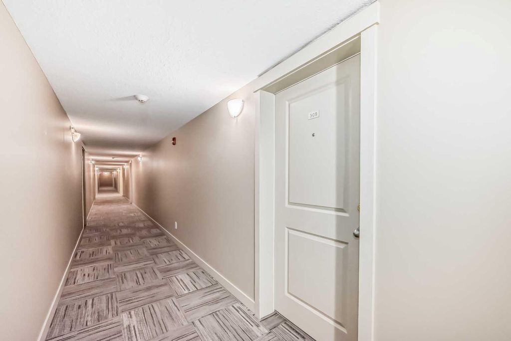 Photo of 403 Mackenzie Way SW #9309, Airdrie, AB T4B 3V7 (MLS # A2287947)