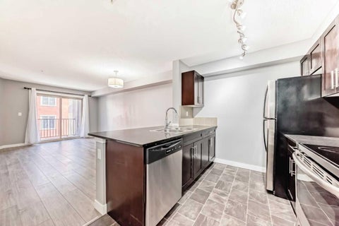 Photo of 403 Mackenzie Way SW #4304, Airdrie, AB T4B 3V7 (MLS # A2328734)