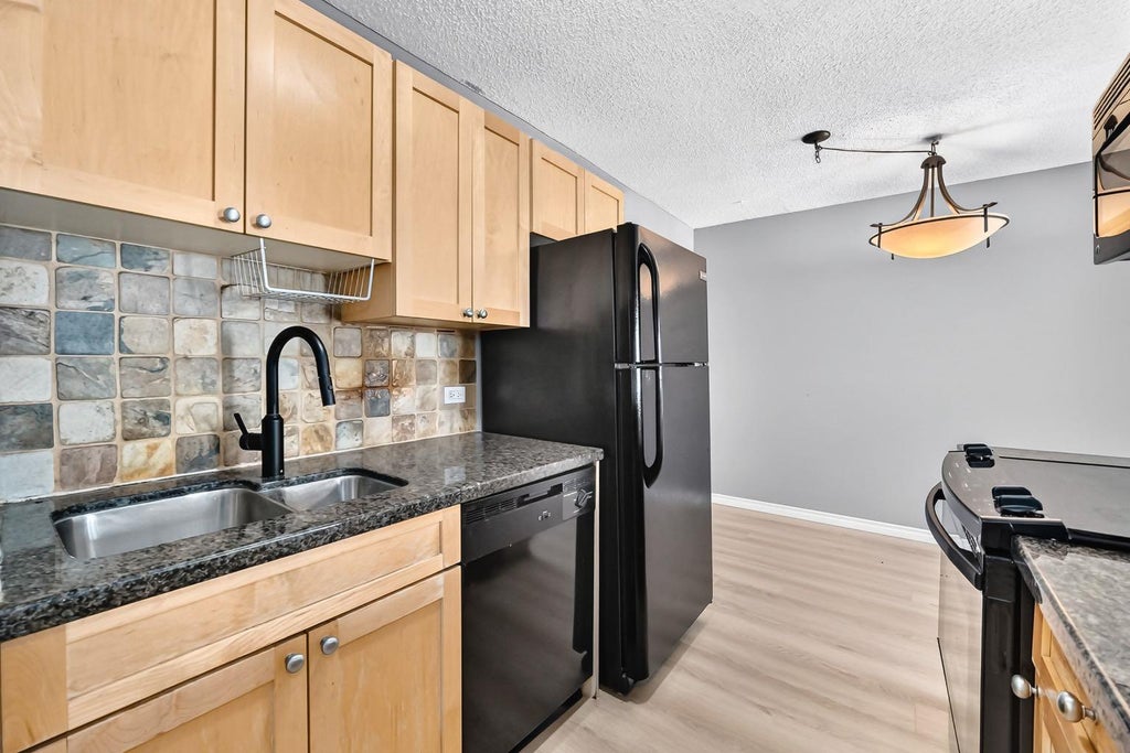 Photo of 1312 13 Avenue SW #501, Calgary, AB T3E 0T3 (MLS # A2338016)