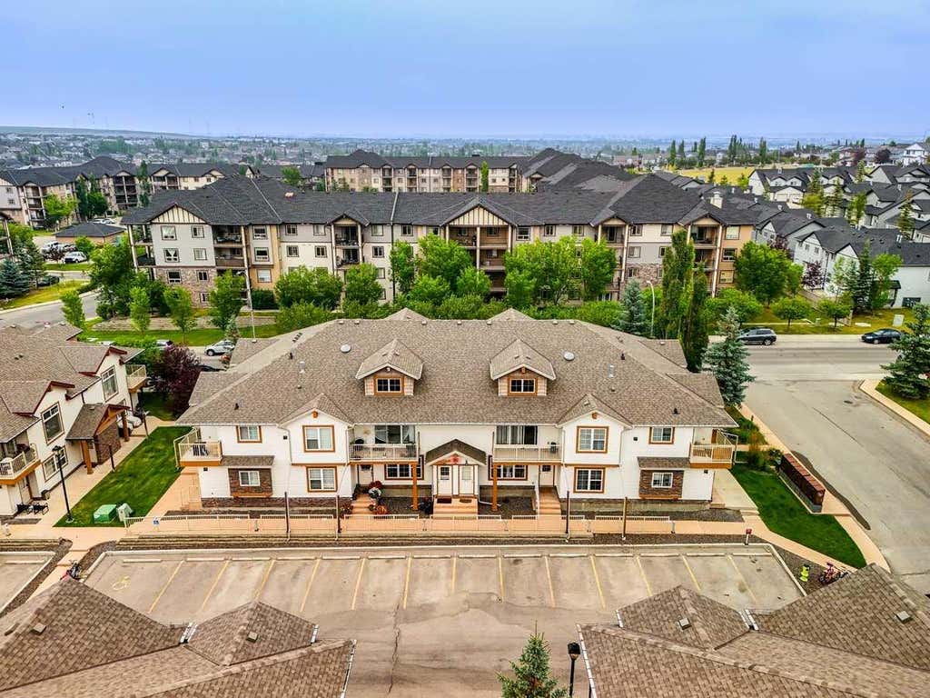 Photo of 20 Panatella Landing NW #104, Calgary, AB T3K 0K8 (MLS # A2336710)