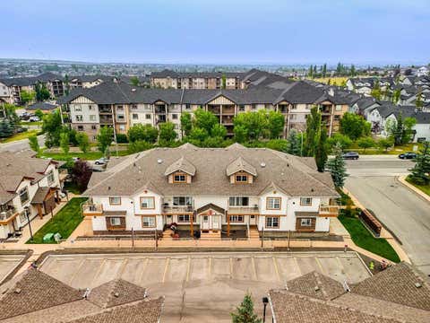 Photo of 20 Panatella Landing NW #104, Calgary, AB T3K 0K8 (MLS # A2336710)