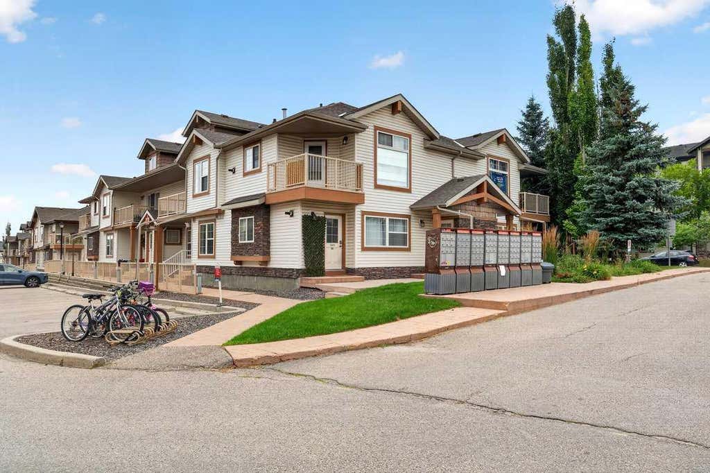 Photo of 20 Panatella Landing NW #104, Calgary, AB T3K 0K8 (MLS # A2336710)
