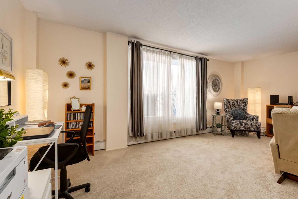 Photo of 315 Heritage Drive SE #120, Calgary, AB T2H 1N2 (MLS # A2311841)