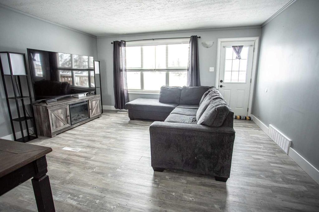 Photo of 10011 100 Street, High Level, AB T0H 1Z0 (MLS # A2290231)