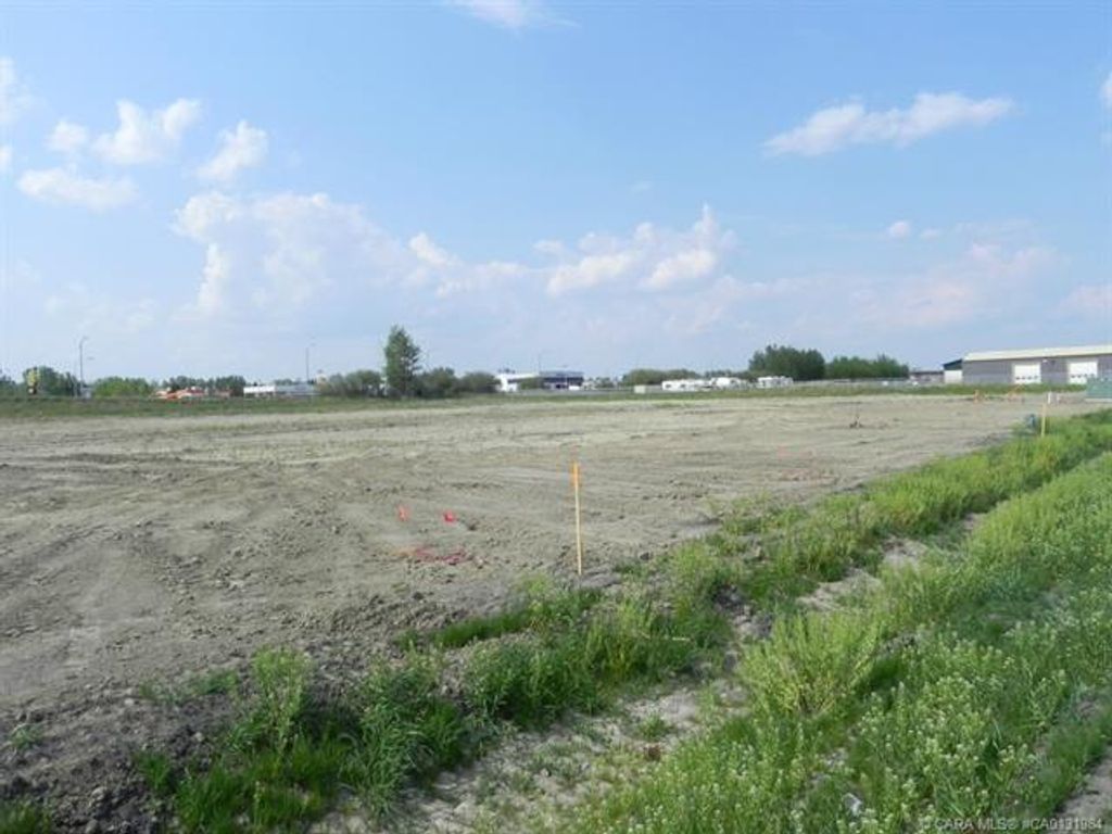 Photo of 5400 Len Thompson Drive, Lacombe, AB T4L 2H3 (MLS # CA0131984)