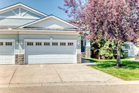 Photo of 19 Rocky Ridge Villas NW, Calgary, AB T3G 4R3 (MLS # A2333325)
