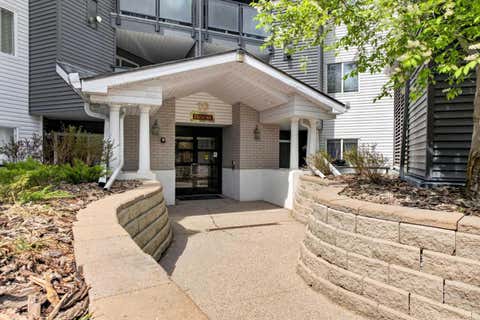 Photo of 10 Sierra Morena Mews SW #418, Calgary, AB T3H 3K5 (MLS # A2338123)