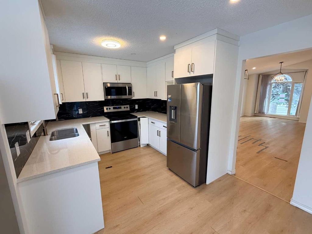 Photo of 651 Macewan Drive NW, Calgary, AB T3K 3R1 (MLS # A2294204)