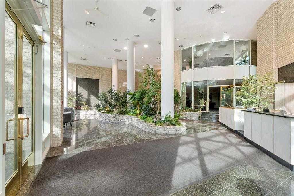 Photo of 837 2 Avenue SW #303, Calgary, AB T2P 0E6 (MLS # A2317517)