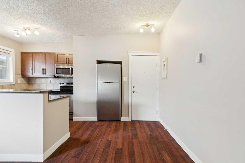 Photo of 605 67 Avenue SW #4, Calgary, AB T2V 0M3 (MLS # A2300361)