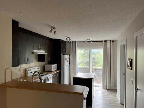 Photo of 2445 Kingsland Road SE #303, Airdrie, AB T4A 0B4 (MLS # A2318582)