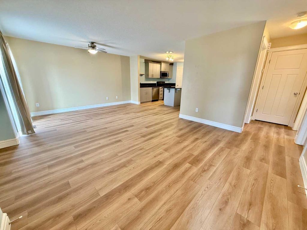 Photo of 899 Mt Sundance Manor W #2, Lethbridge, AB T1J 1X7 (MLS # A2296120)