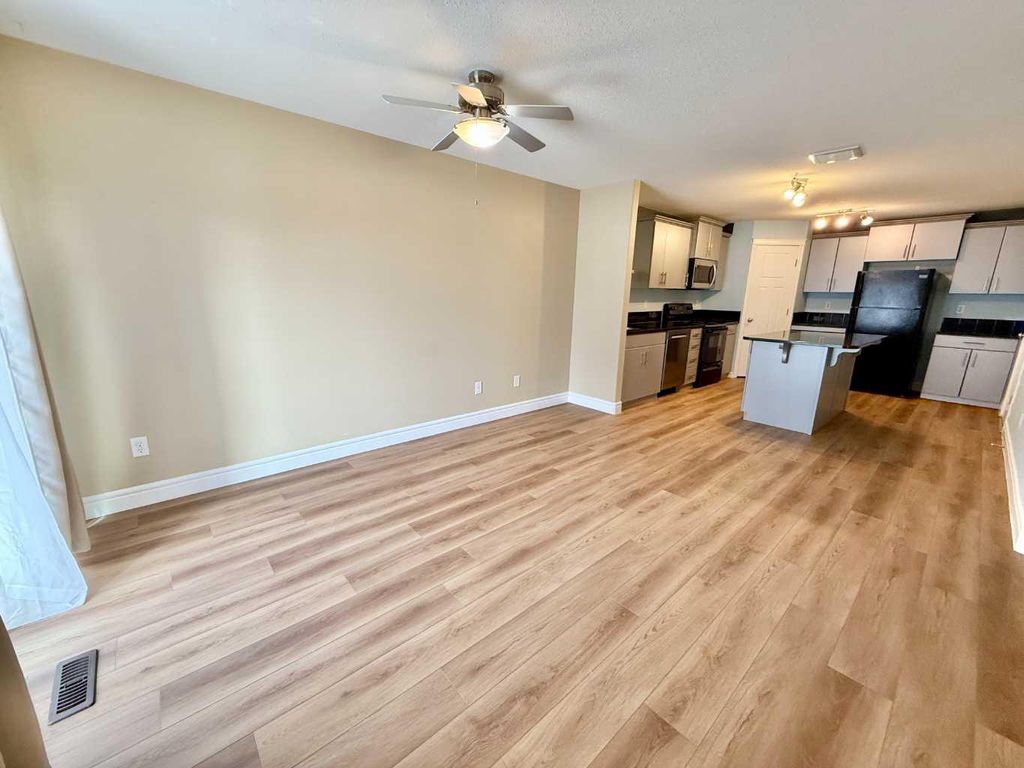 Photo of 899 Mt Sundance Manor W #2, Lethbridge, AB T1J 1X7 (MLS # A2296120)