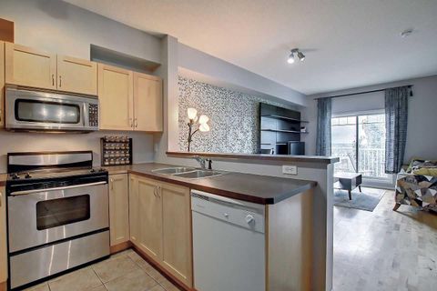 Photo of 70 Panamount Drive NW #9303, Calgary, AB T3K 6K6 (MLS # A2293894)
