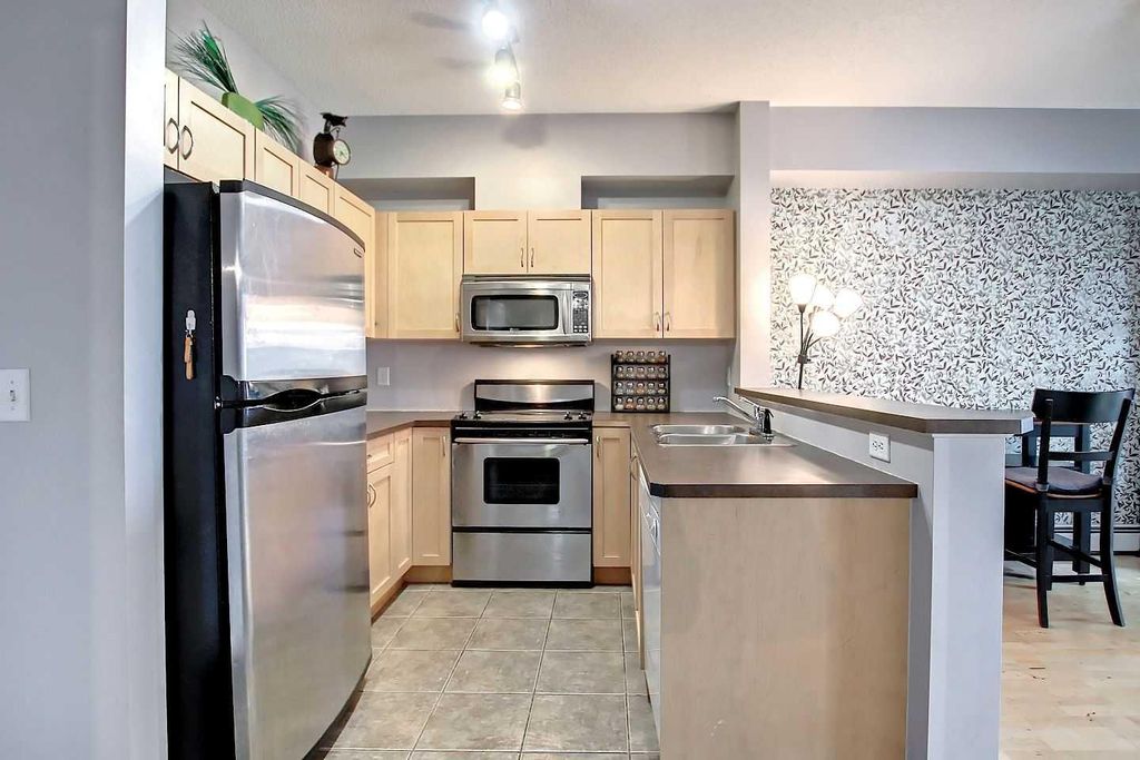 Photo of 70 Panamount Drive NW #9303, Calgary, AB T3K 6K6 (MLS # A2293894)
