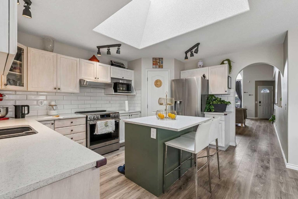 Photo of 1420 Meadowbrook Drive SE, Airdrie, AB T4A 2B4 (MLS # A2343693)