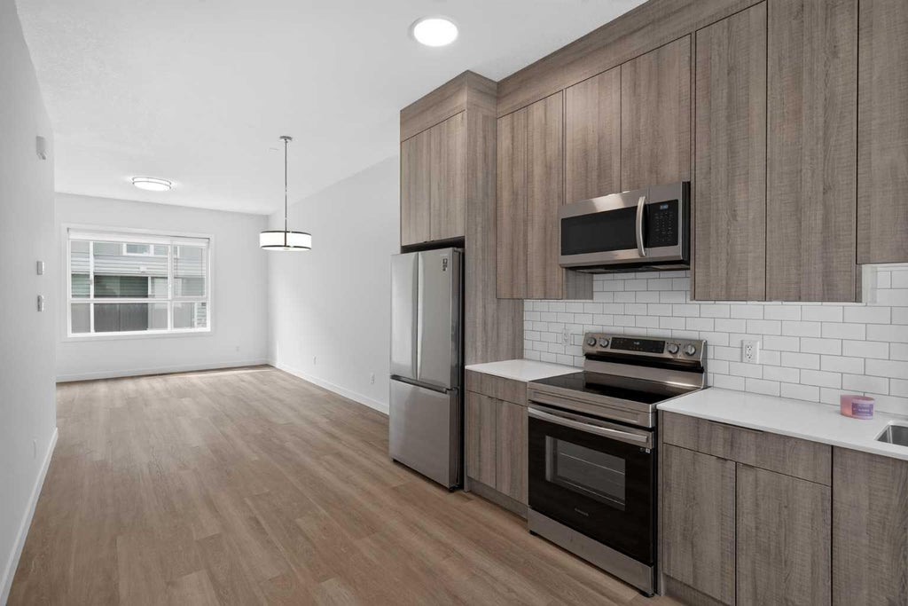 Photo of 101 Panatella Square NW #202, Calgary, AB T3K 2R9 (MLS # A2351397)