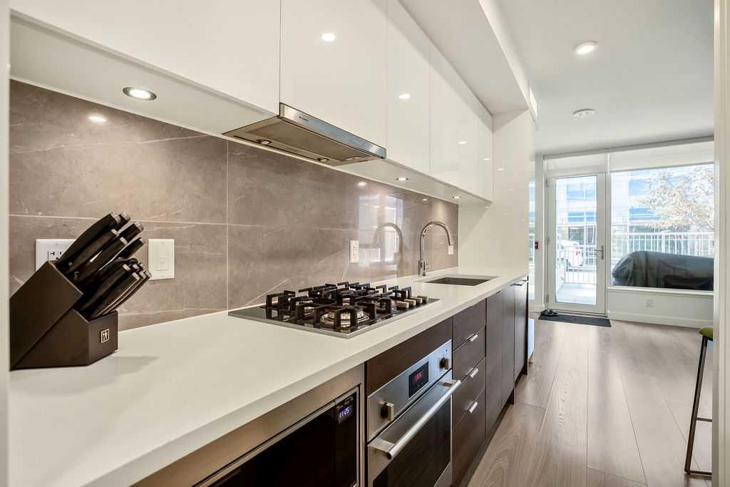 Photo of 108 Waterfront Court SW #103, Calgary, AB T2P 1K7 (MLS # A2255840)