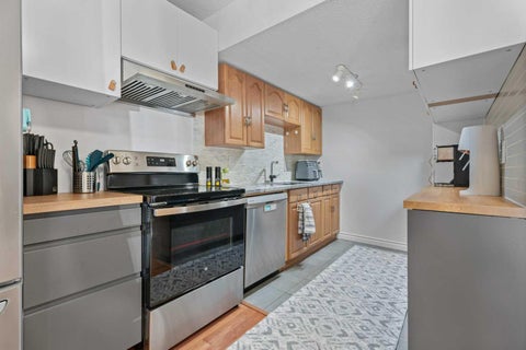 Photo of 9930 Bonaventure Drive SE #302, Calgary, AB T2J 4L4 (MLS # A2349493)