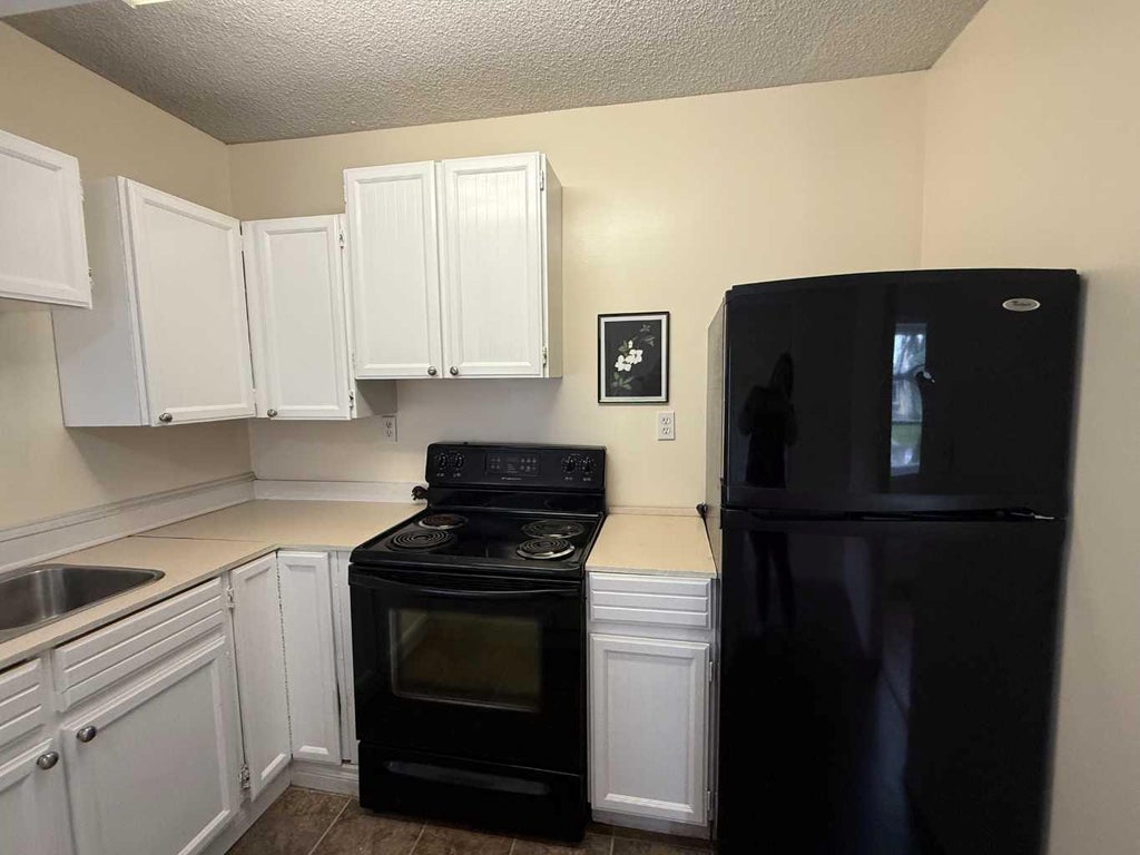 Photo of 4911 53 Avenue, Grimshaw, AB T0H 1M0 (MLS # A2325010)