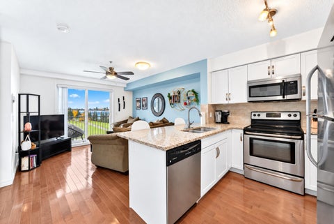 Photo of 115 Prestwick Villas SE #3312, Calgary, AB T2Z 0M7 (MLS # A2351353)