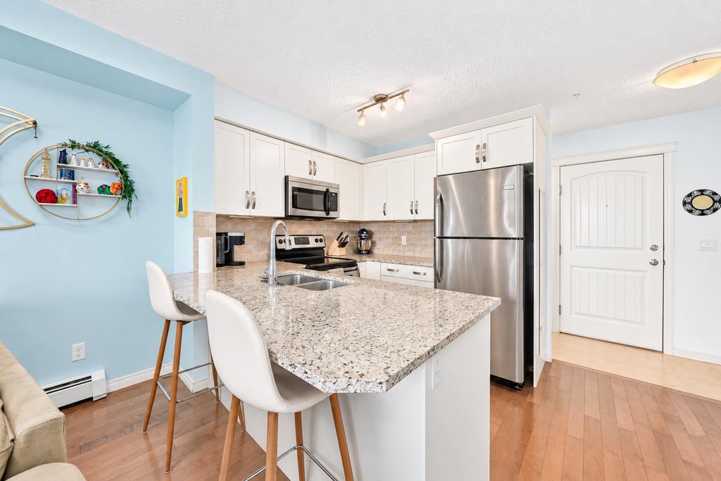 Photo of 115 Prestwick Villas SE #3312, Calgary, AB T2Z 0M7 (MLS # A2351353)