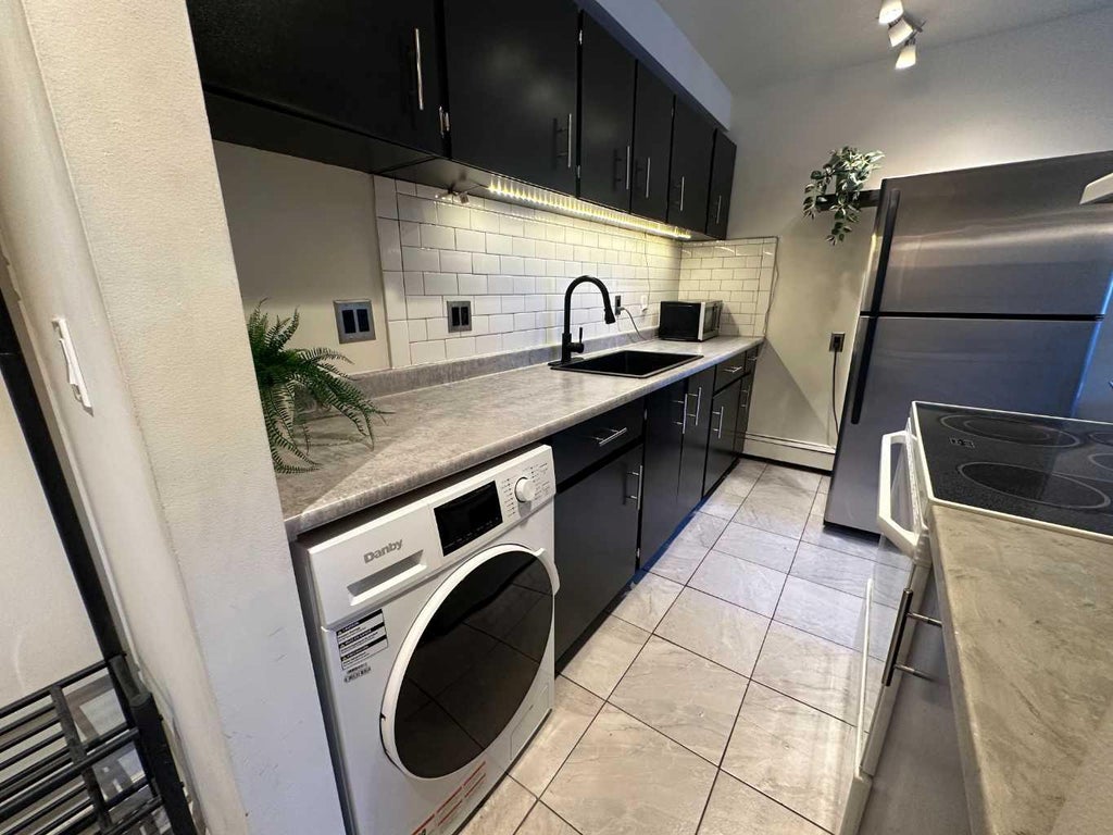 Photo of 1829 11 Avenue SW #206, Calgary, AB T3C 0N2 (MLS # A2337943)