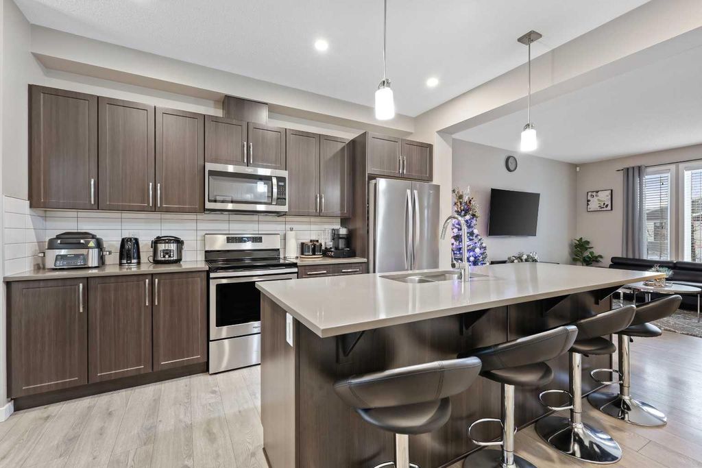 Photo of 754 Belmont Drive SW, Calgary, AB T2X 4H4 (MLS # A2287782)