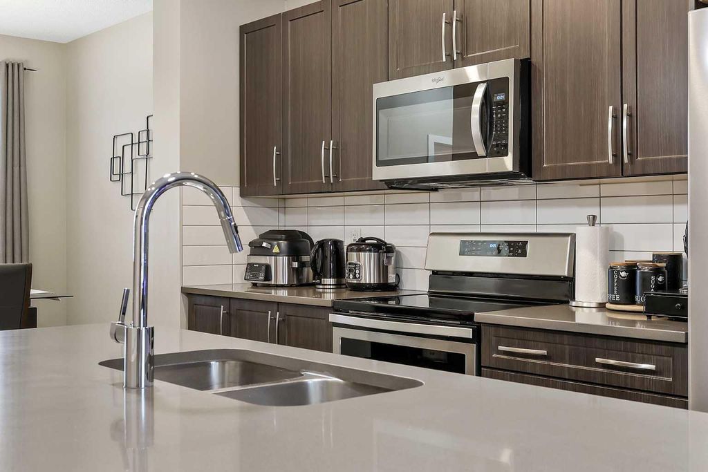 Photo of 754 Belmont Drive SW, Calgary, AB T2X 4H4 (MLS # A2287782)