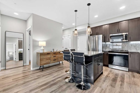 Photo of 150 Shawnee Square SW #401, Calgary, AB T2Y 0T6 (MLS # A2313019)