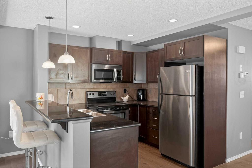 Photo of 51 Country Village Villas NE, Calgary, AB T3K 0L7 (MLS # A2294713)