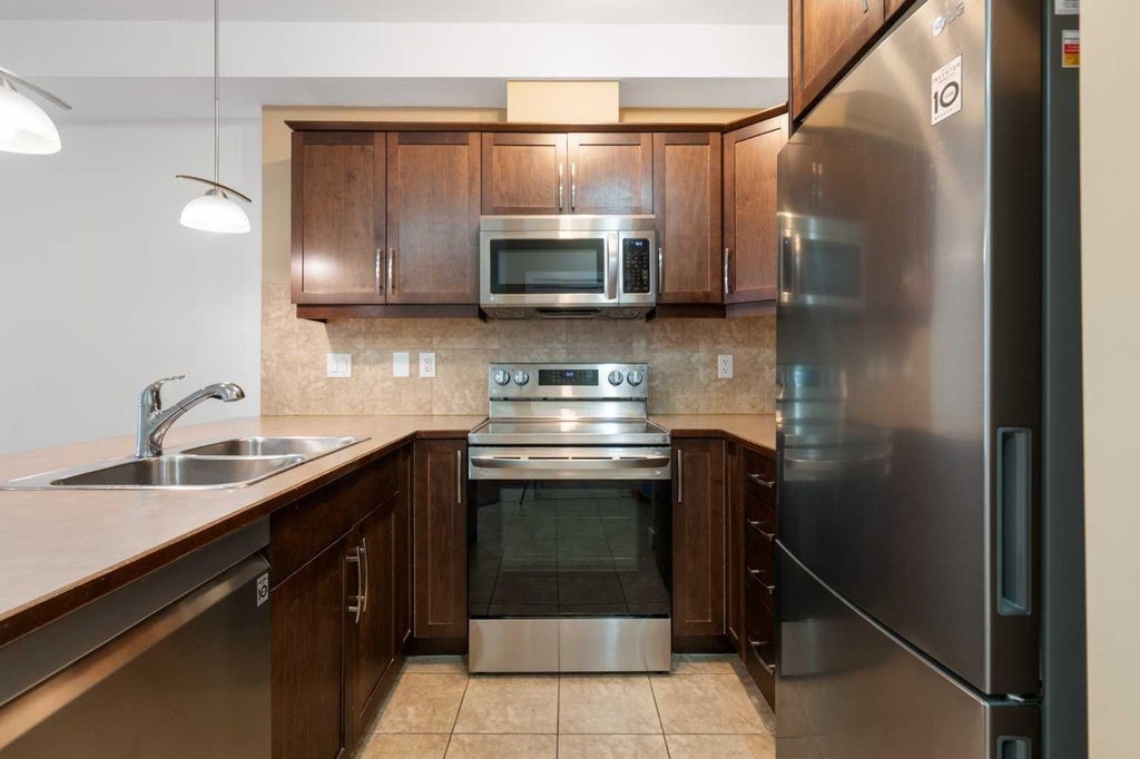 Photo of 15304 Bannister Road SE #210, Calgary, AB T2X 0M8 (MLS # A2340709)