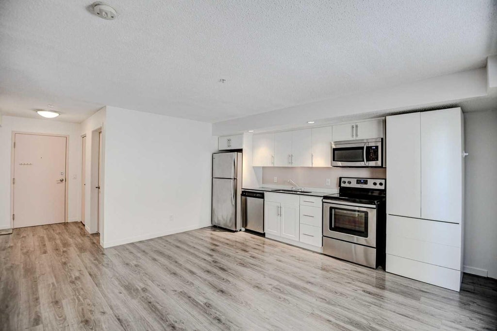 Photo of 1920 11 Avenue SW #106, Calgary, AB T3C 0N8 (MLS # A2349854)