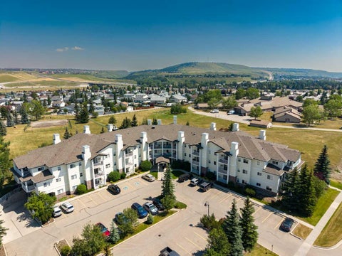Photo of 72 Quigley Drive #201, Cochrane, AB T4C 2K6 (MLS # A2343460)