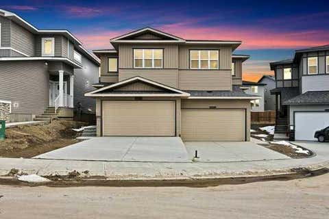 Photo of 82 Heritage Circle, Cochrane, AB T4C 3G9 (MLS # A2327836)
