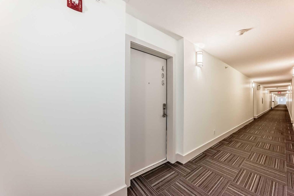 Photo of 4303 1 Street NE #406, Calgary, AB T2E 7M3 (MLS # A2341826)