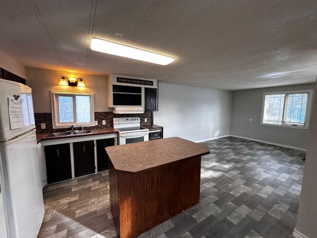 Photo of 5103 61 Avenue #8, Olds, AB T4H 1E6 (MLS # A2294892)