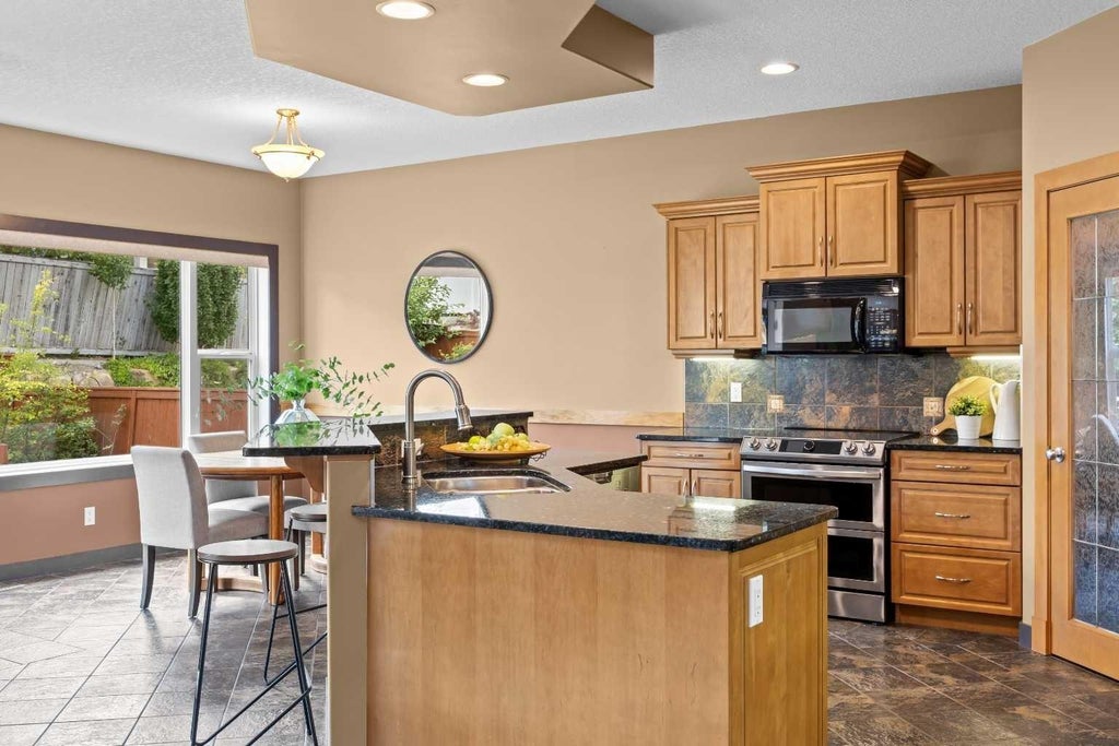 Photo of 139 Tuscany Ridge Close NW, Calgary, AB T3L 2K6 (MLS # A2336244)