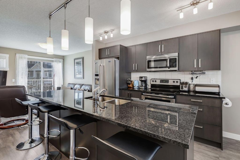 Photo of 1225 Kings Heights Way SE #402, Airdrie, AB T4A 0T7 (MLS # A2311855)