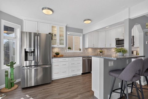 Photo of 567 Edmonton Trail NE #9, Airdrie, AB T4B 2L4 (MLS # A2349892)