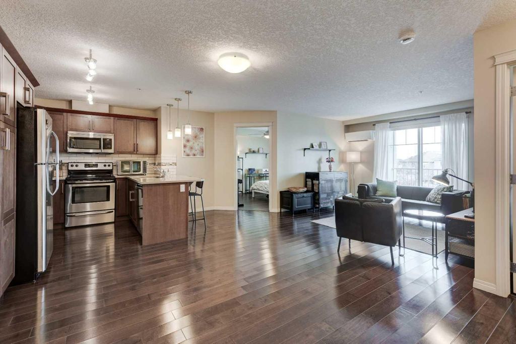 Photo of 406 Cranberry Park SE #306, Calgary, AB T3M 1Y9 (MLS # A2278452)