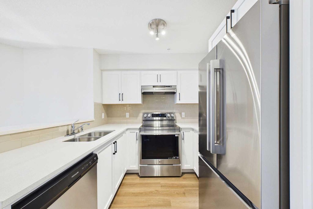 Photo of 115 Prestwick Villas SE #1203, Calgary, AB T2Z 0N1 (MLS # A2350774)