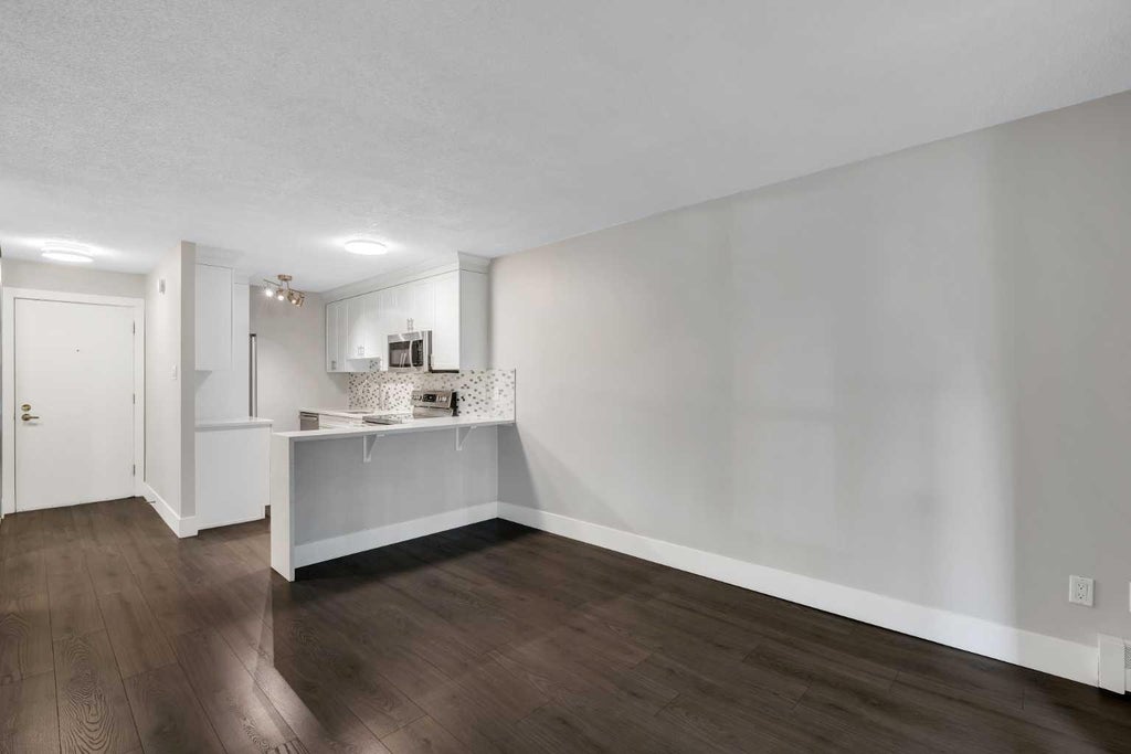 Photo of 1015 14 Avenue SW #103, Calgary, AB T2R 0N9 (MLS # A2349440)