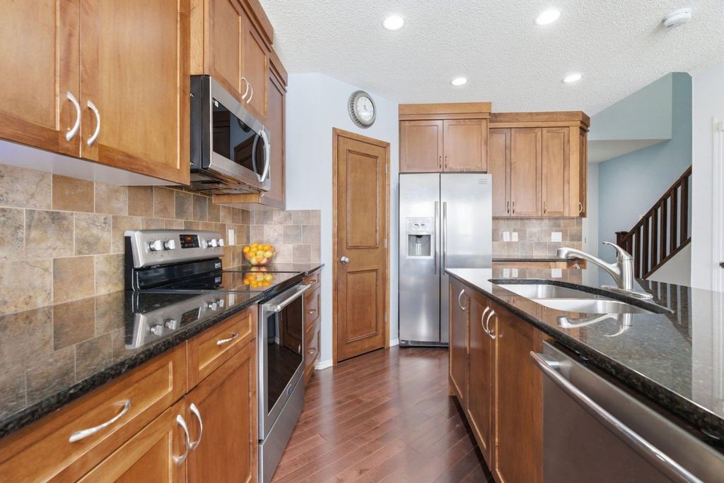 Photo of 512 Panatella Square NW, Calgary, AB T3K 0T5 (MLS # A2299653)